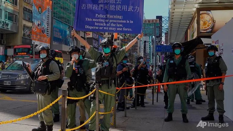 Hong Kongers march in silent protest against national security laws