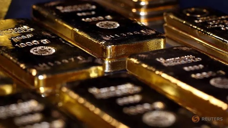 Gold hits a high, more precious as dollar loses value