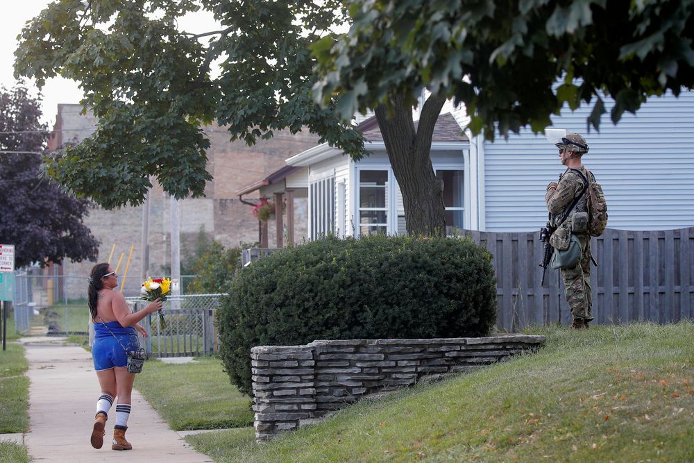 Anti-racism protesters rally in Kenosha, watched by National Guard reinforcements