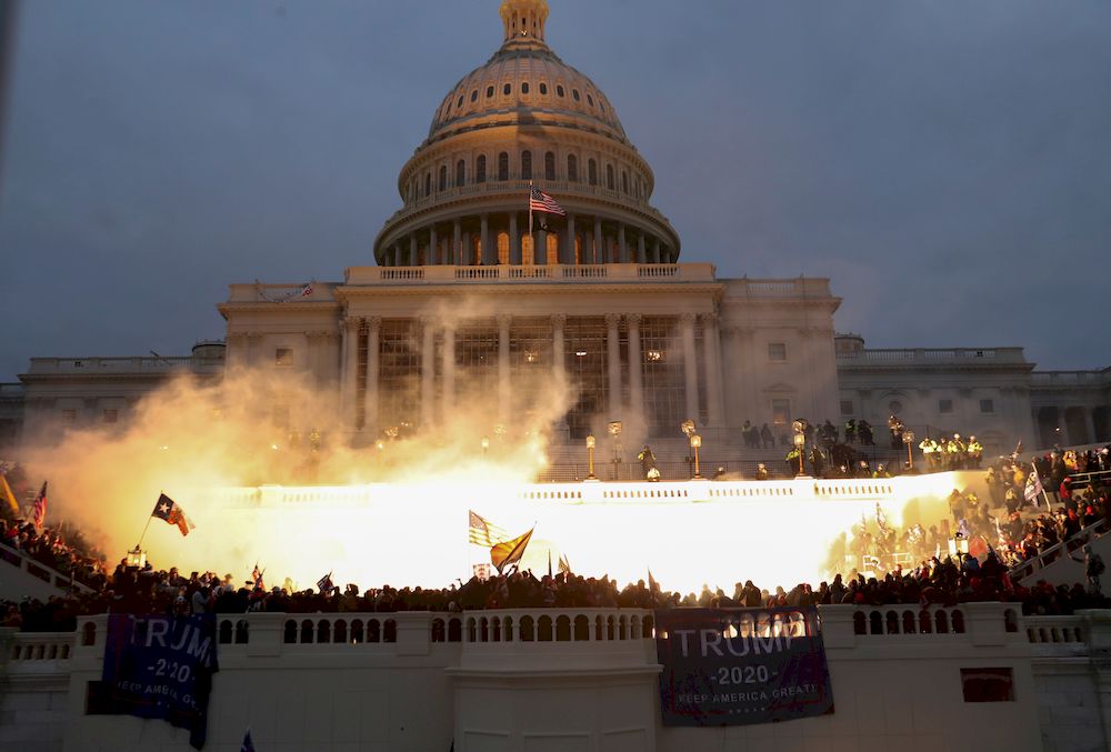 Under heavy guard, Congress back to work after Trump supporters storm US Capitol