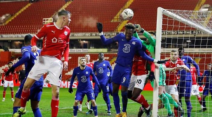 Football: Abraham the hero at both ends as Chelsea edge past Barnsley